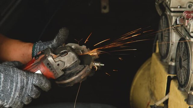 The mechanic was grinding a piece of the dynamo and sparks flew.