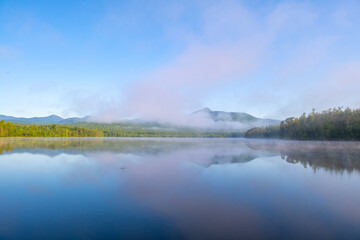 landscape of morning lake in the fog