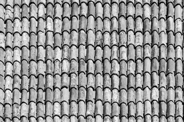 old antique roof tiles at the roof of an old house