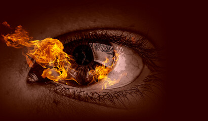 Macro image of human eye with fire flames