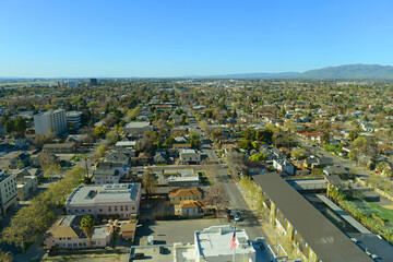Aerial view of San Jose historic city center and residential area landscape in summer, from top of the City Hall, San Jose, California CA, USA.  - obrazy, fototapety, plakaty