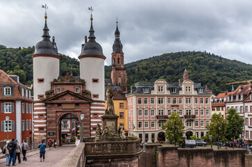 Fototapeta premium Heidelberg, Germany. Old Bridge and Neckartor Gate with two twin towers 