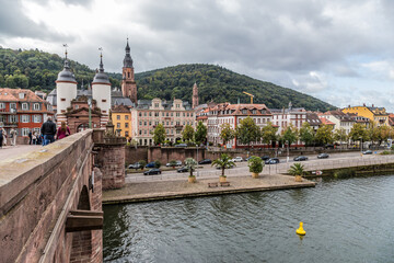Heidelberg, Germany. Old Bridge (Karl Theodor Bridge), embankment and Neckartor gate with two twin towers 