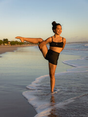 Beach yoga practice. Svarga Dvijasana, Paradise Bird Pose. Strong legs. Standing balancing asana....