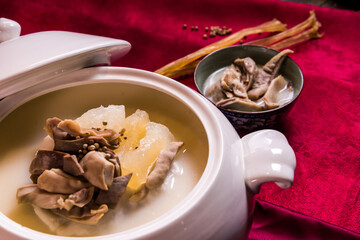 luxury braised stew shark's fin thick soup with scallop seafood and meat in big plate on wood table