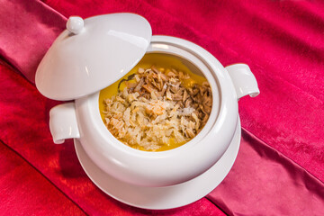 luxury braised stew shark's fin thick soup with scallop seafood and meat in big plate on wood table