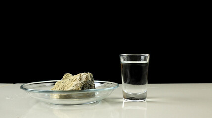 Calcium carbide or CaC2 and Water. Calcium carbide reacts on contact with water and produces...