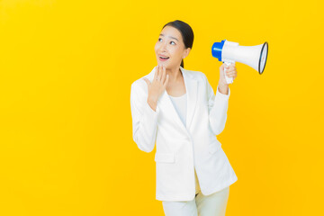 Portrait beautiful young asian woman smile with megaphone