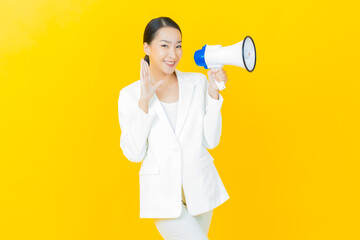 Portrait beautiful young asian woman smile with megaphone