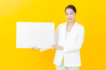 Portrait beautiful young asian woman with empty white billboard