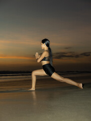 Beach yoga. Ashta chandrasana. High lunge pose lengthens the sides of the body, opens hips. Hands in namaste mudra. Healthy life. Water reflection. Copy space. Yoga retreat. Seminyak beach, Bali