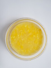 sweet corn soup made by mung bean, corn slices, sticky rice.