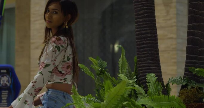 Amazing young fashion model turns around with her hair flowing in the wind