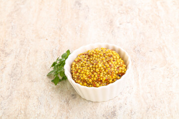 Grain mustard sauce in the bowl