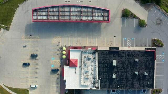 Convenience store, gas station, fuel fill up. Top down aerial view of canopies and retail store.