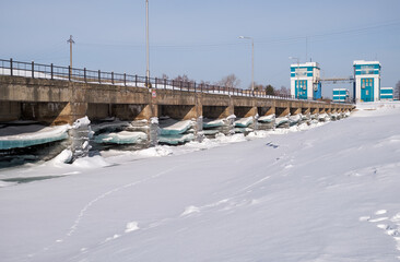 Floodgate and dam on Ob Sea in winter season. Novosibirsk, Siberia, Russia