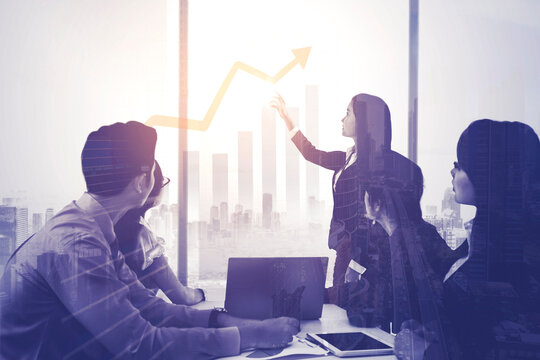 Businesswoman doing presentation with colleagues