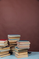 Stacks of Books for College Library Training Brown Background
