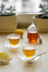 tea drinking in transparent glass dishes