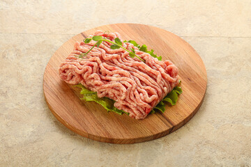 Raw minced pork meat over board