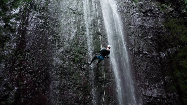 Aerial view of abseiling down a waterfall
