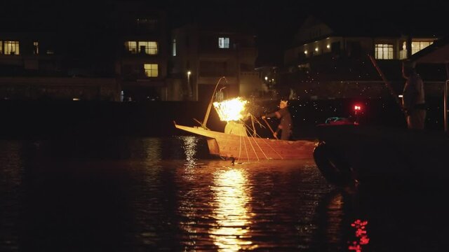 Boat traveling down Nagara River, Cormorant Fishing Festival in Japan