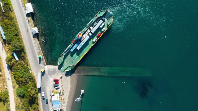 Timelapse Of Lorries Loading Onto Ferry From Chiloe Island. Aerial Top Down View