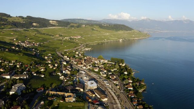 Aerial View Of Vineyards, Cully Village, And Railroad On Lakefront Of Lake Geneva In Lavaux, Switzerland.