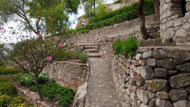 Stone Walls With Walking Path And Stairs In A Landscaped Garden At The Apolonia Park In Cajamarca, Peru. - Pan Right Shot