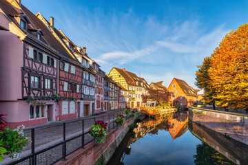 Colmar France, colorful half timber house city skyline at Ill River with autumn foliage season