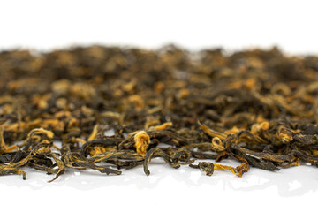 Dry black tea leaves isolated on white background