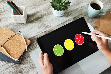Colored smiles. Customer satisfaction control on device screen. Service and quality improvement...