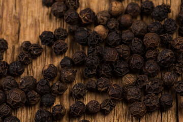 black pepper on wooden table
