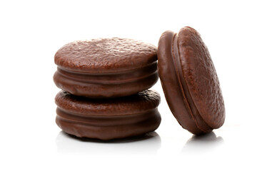 Round chocolate cookies on a white background