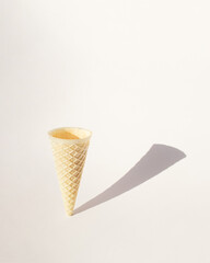 ice cream cone standing on a white background with shadow.aesthetic design.summer end or autumn concept idea