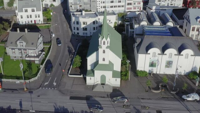 Free Lutheran Church in Reykjavik, sunlight during dusk, Iceland, aerial