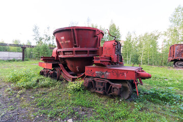 red trolley with a container on rails