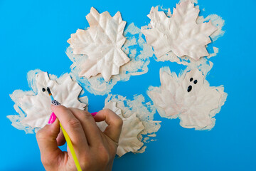 Maple leaf with painted face as decoration for autumn Halloween holiday celebration. Halloween...