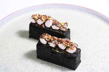 luxury hand made Micheline French modern Chocolate Ecstacy Bar dessert on white black background