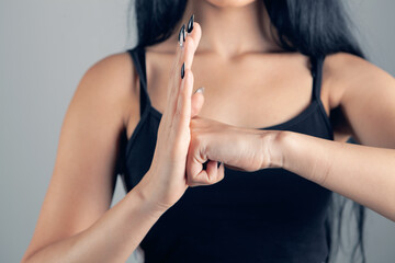 woman showing protection from violence gesture