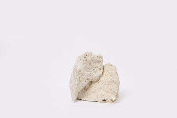 Stone podium for products, cosmetics, cream or perfumes on white background.