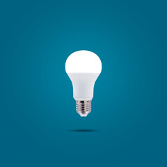 LED energy saving lamp 230v isolated on blue pastel color background.