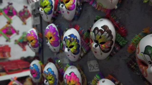 Colorful Butterfly Painted Carnival Masks Displayed In A Local Market At Cajamarca, Peru. - Slow Motion, Dolly Out