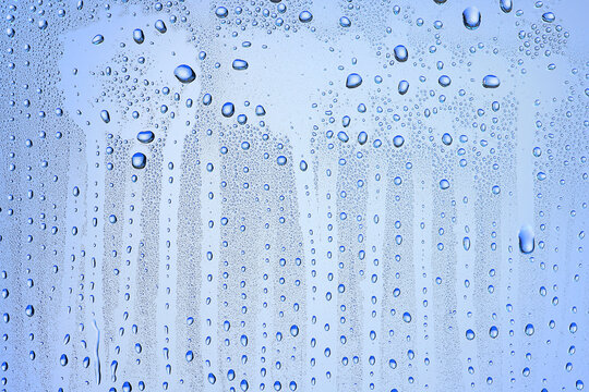 drops glass blue background abstract, transparent cold background water splashes © kichigin19
