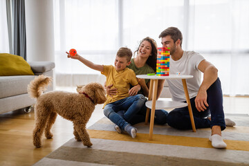 Happy young family having fun together at home. Happy childhood concept