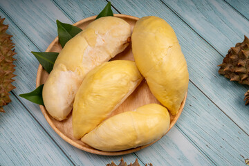 Durian fruit  on blue wooden background, Close up fresh Durian on wooden background .
