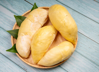 Durian fruit  on blue wooden background, Close up fresh Durian on wooden background .