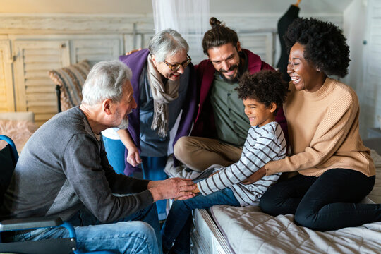 Portrait of happy multi-generation multiethnic family having fun together at home