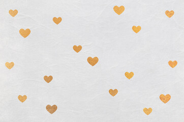 Heart pattern washi texture background. Gold heart pattern on white Japanese paper.