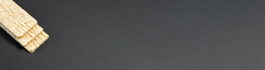 Healthy food. Airy diet loaves lie on a black background. diet food. banner for placement on the site